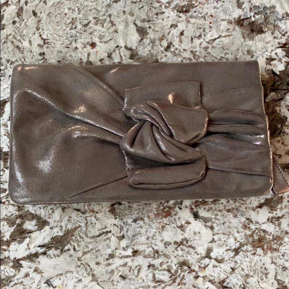 Under-loved Joujou evening handbag. Metallic w bow